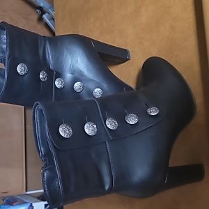 Womens black  3.5 heel boots.New never worn. Man made material like leather NWOT